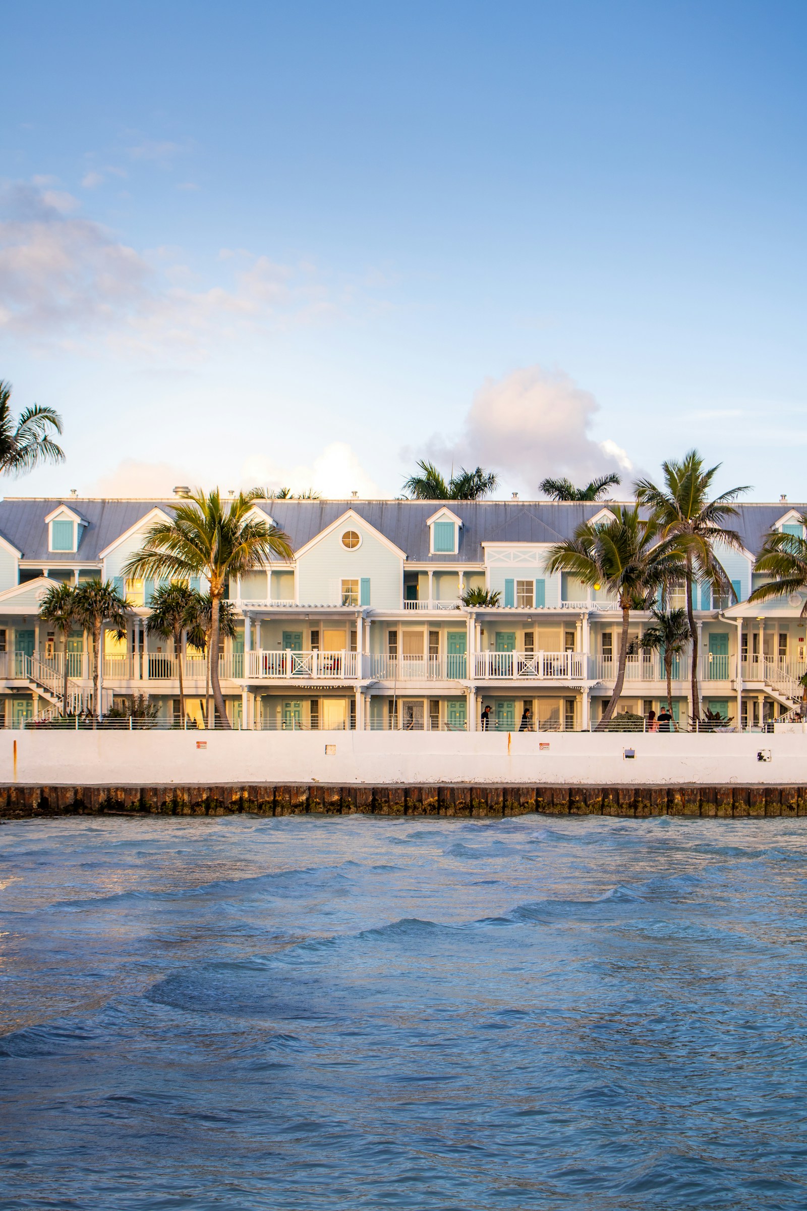 Key West waterfront with pastel buildings and palm trees