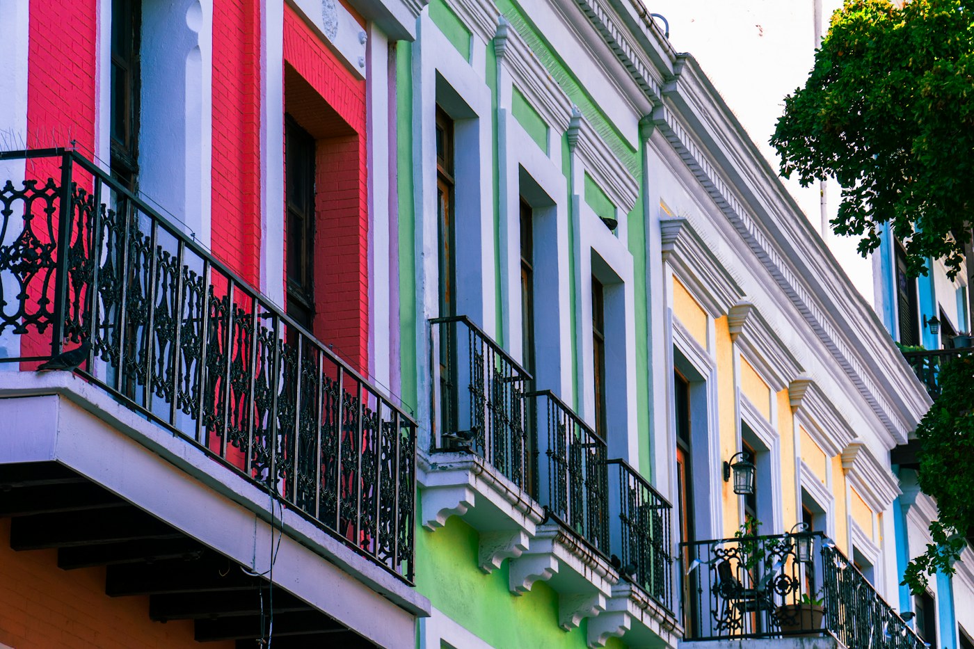 Vibrant colonial facades and balconies on a street in Old San Juan, Puerto Rico