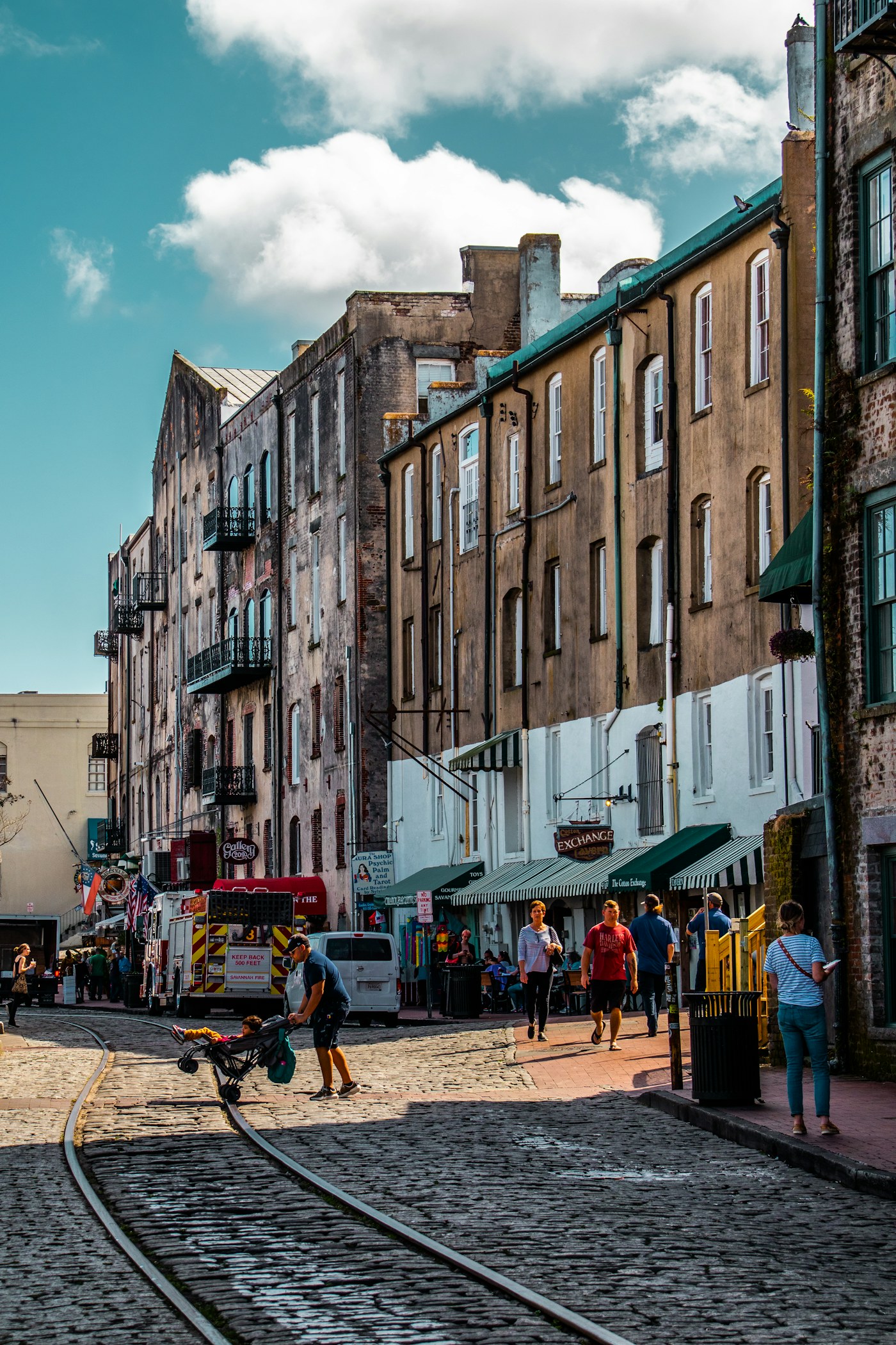 Historic buildings and a sunny waterfront street in Savannah, Georgia