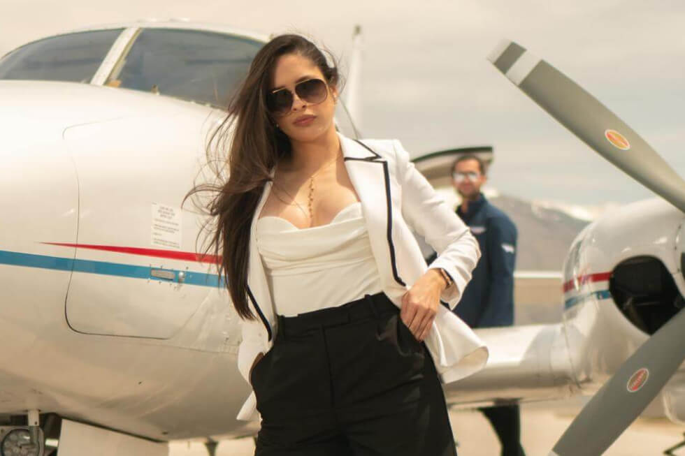 Passenger in front of SoCal Airways aircraft
